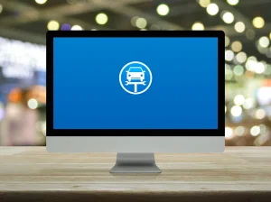 „Computerbildschirm mit Auto-Symbol – Austausch im Getriebeschaden-Forum.